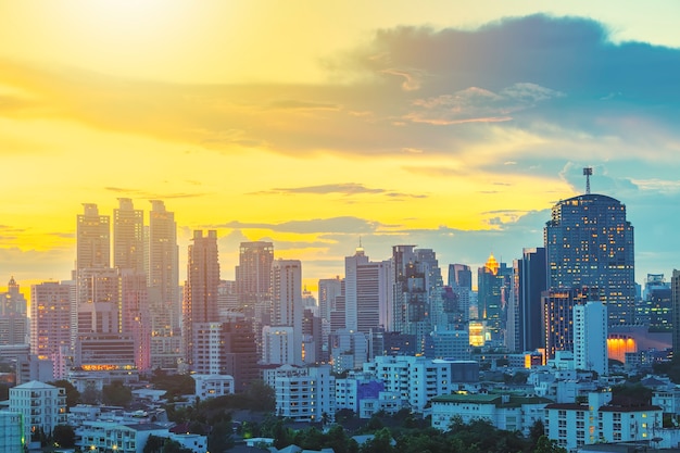 Business city center of Bangkok at sunset with beautiful sky.