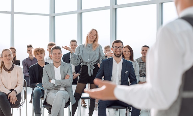 Business coach at a meeting with a group of young business
people