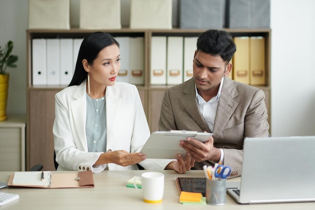 Business Colleagues Discussing Document