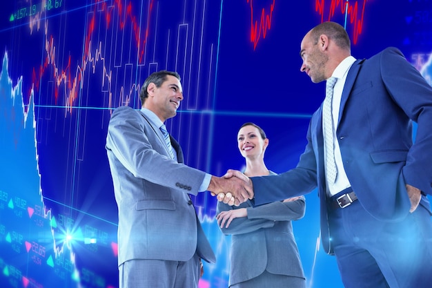 Business colleagues greeting each other against stocks and shares