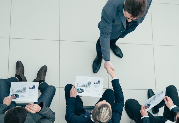 Business colleagues greeting each other at a business meeting