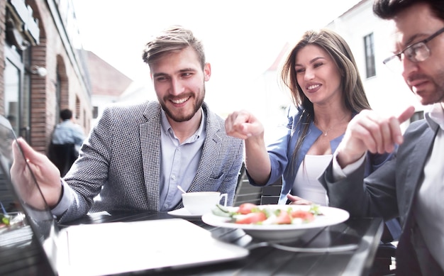 Business colleagues sitting at a table in a cafe