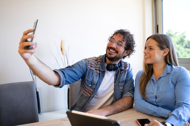 business colleagues take a selfie at the meeting