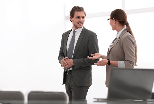 Business colleagues talk in a modern office