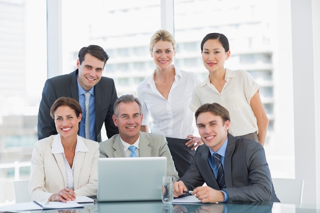 Business colleagues with laptop at office desk