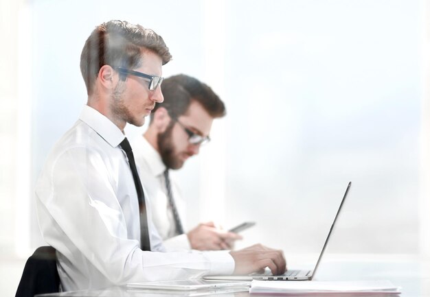 Business colleagues work online sitting in the office