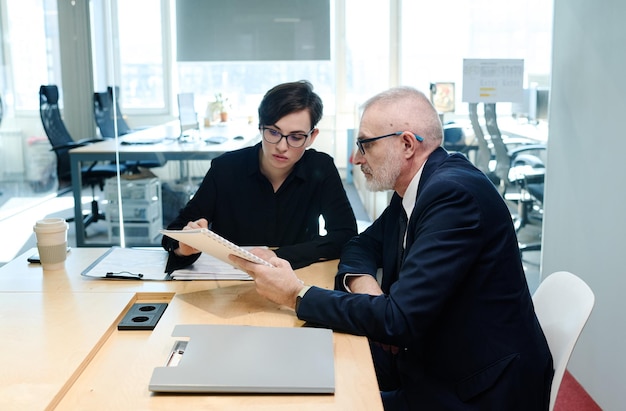 Business colleagues working over report together