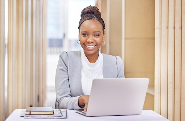 Business comes first Cropped portrait of an attractive young businesswoman working on her laptop in the office