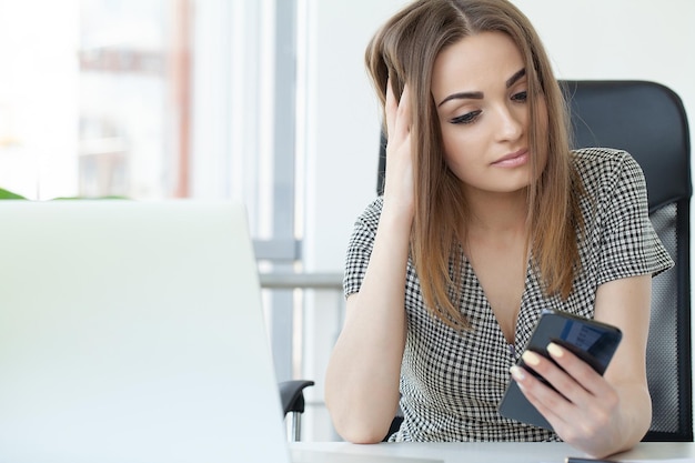 Business concept businesswoman talking on the phone in office