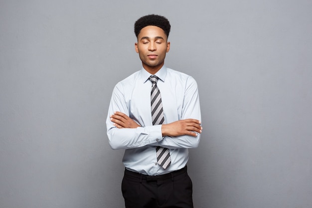 Business Concept - Happy professional african american businessman confident arms crossed.