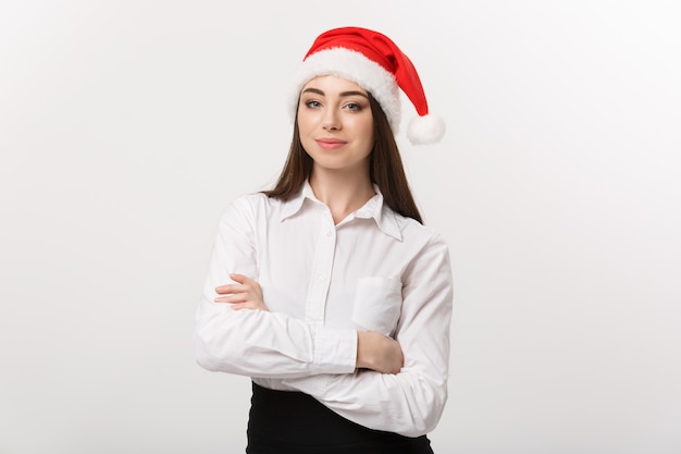 Business concept  modern caucasian business woman in christmas theme arm crossed posing on white  wall with copy space