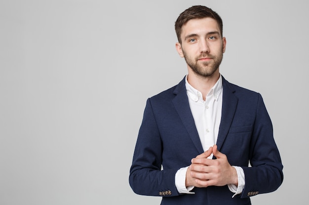 Photo business concept - portrait handsome business man holding hand with confident face. white background. copy space.