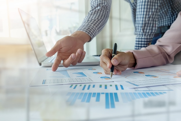 business concept. rows of coins for finance and banking concept with business man and woman. a metaphor of international financial consulting.