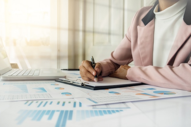 Business concept. Rows of coins for finance and banking concept with business man and woman. A metaphor of international financial consulting.