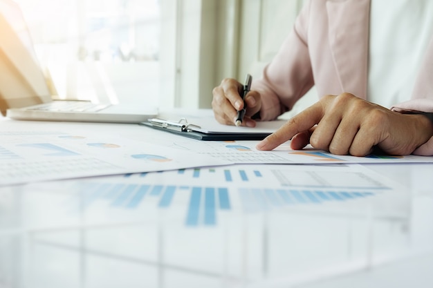 Business concept. Rows of coins for finance and banking concept with business man and woman. A metaphor of international financial consulting.