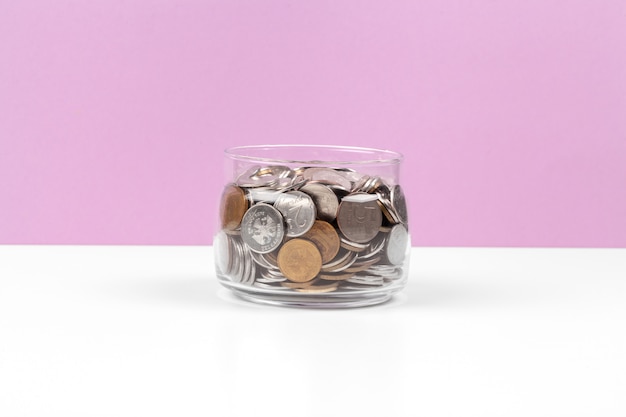 Business concept, saving planning with coins in glass jar