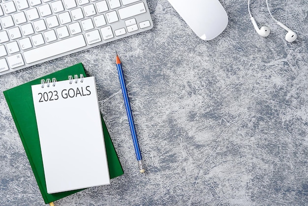 Business concept of top view 2023 goals list with notebook, Notebook.