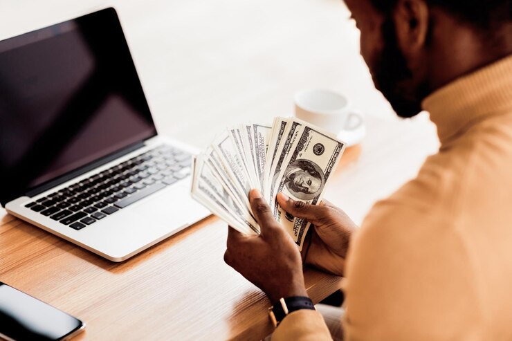Photo business concept unrecognizable black businessman counting money us dollar bills rear view