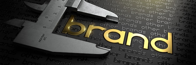 Фото Бизнес-концепция с золотым словом бренда на черном фоне и штангенциркуль