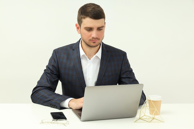 Business concept with young man working on laptop.