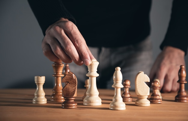 Business concept, the young man playing chess