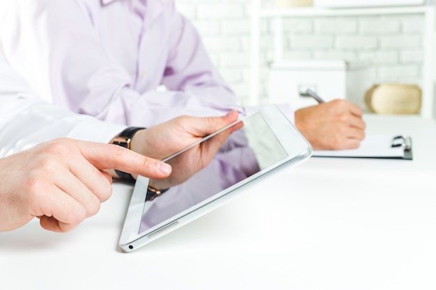 Business concepts, Businessman uses a digital tablet 