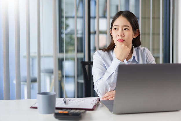 Business concepts Businesswoman sit to thoughtful about new project while looking out the window