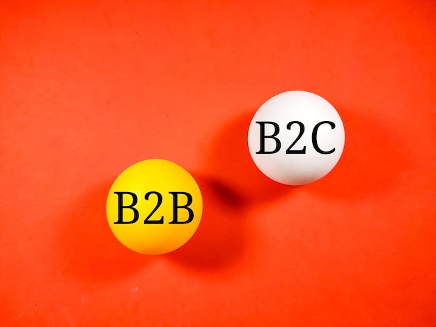 写真 ビジネスコンセプトテキスト b2b business to business および b2c business to customer 赤の背景にピンポン球に書かれました