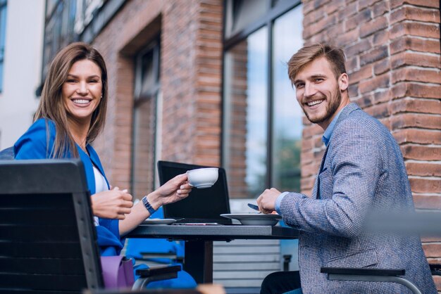 Business couple at a meeting in a street cafelunch break