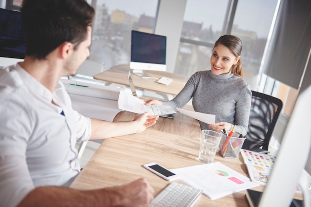 Business couple in modern office