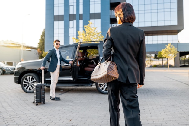 Business couple travel by car