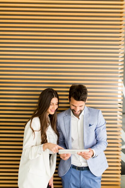 Business couple using tablet