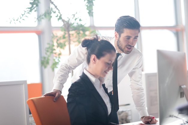 business couple working together on project at modern startup office