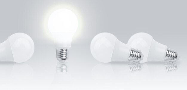 灰色の背景に電球を使用したビジネスの創造性とインスピレーションの概念