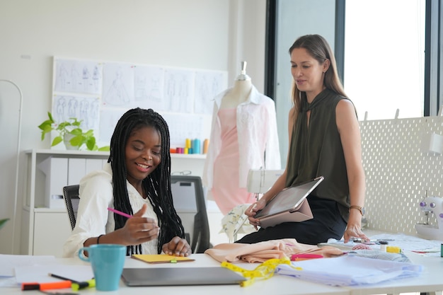 Business discussions Shot of businesswomen brainstorming in an office Two women working at the office