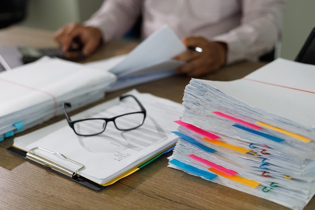 Photo business documents concept document achieves on folders papers at busy work desk office