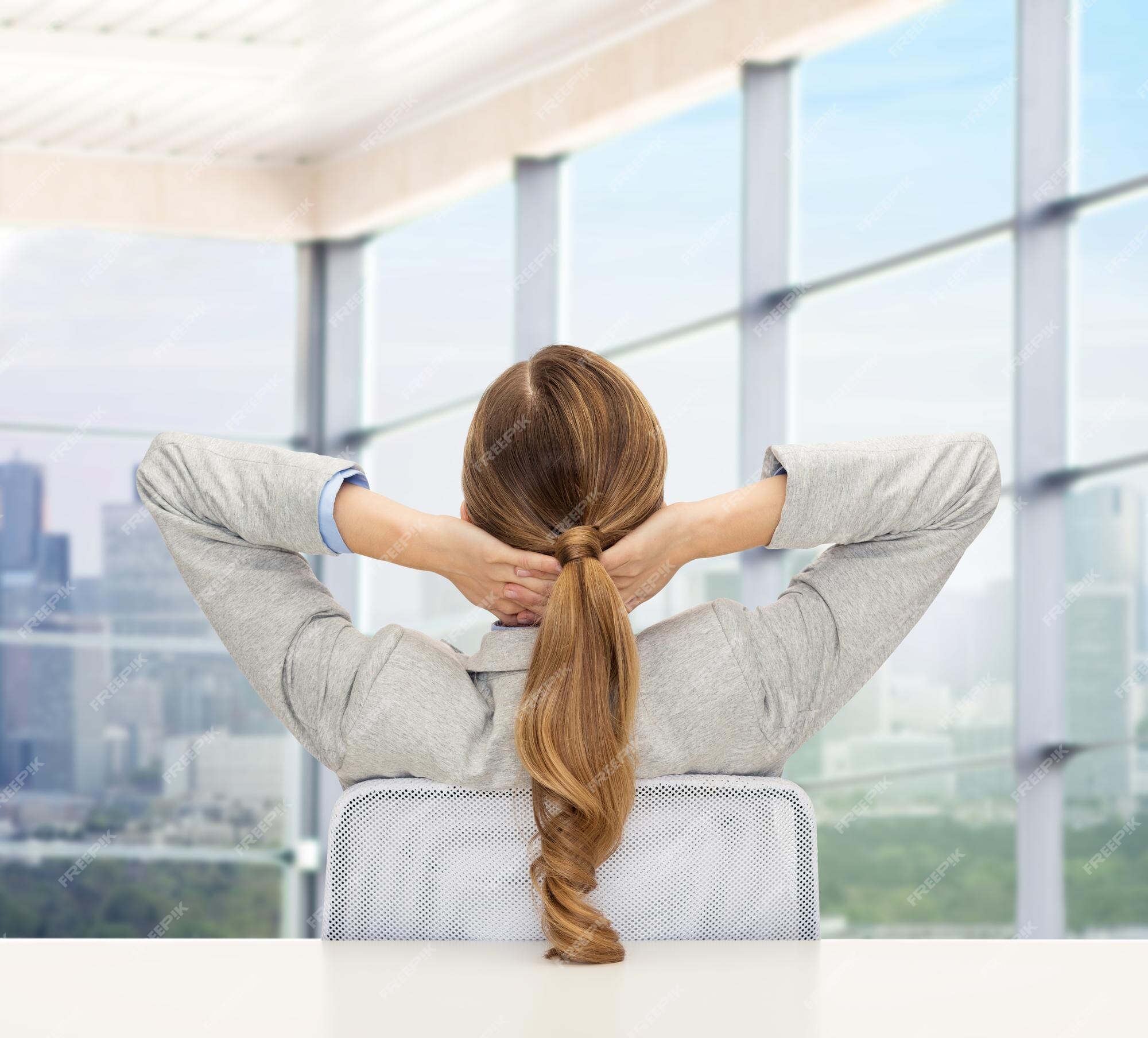 Premium Photo | Business, education, people and office concept -  businesswoman or teacher sitting on chair from back over office window  background