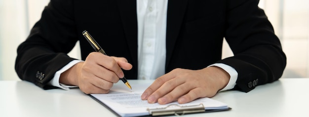Business executive signing contract agreement document Shrewd