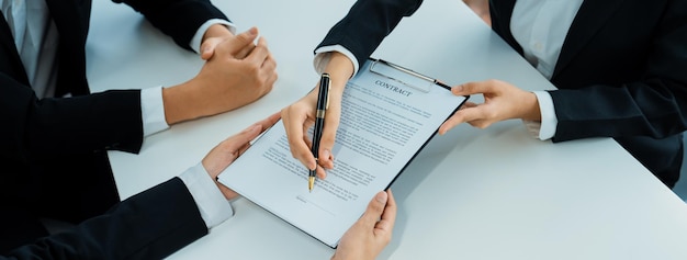 Business executive signing contract agreement document Shrewd