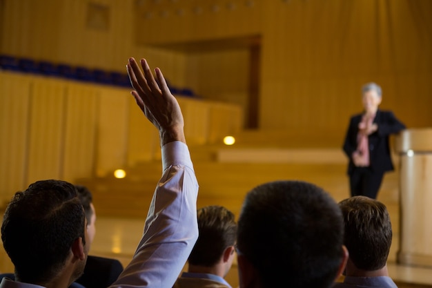 Business executives actively participating in conference center