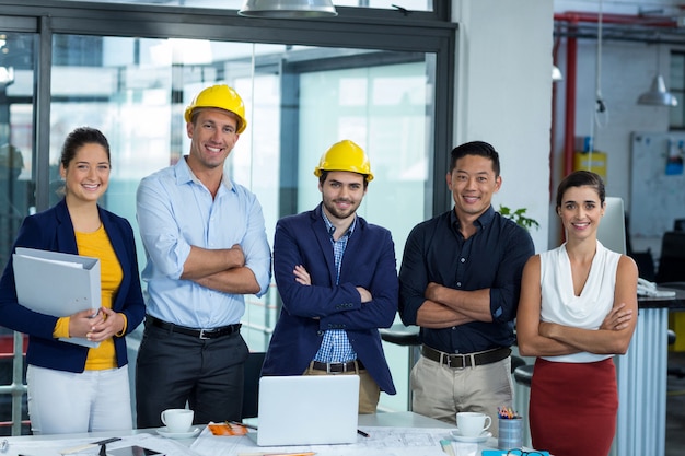 Business executives standing together in office