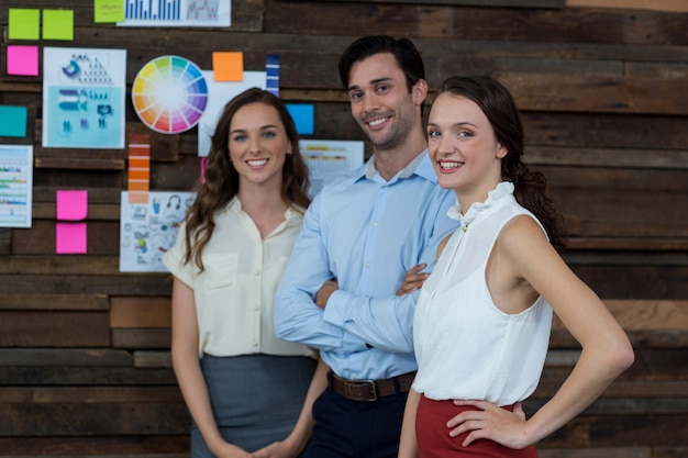 Business executives standing together in office