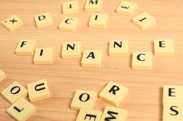 Business and finance concept the concept of typographic letters\
of finance writing on blocks