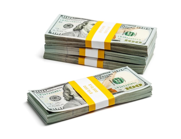 business finance making money concept stack of bundles of US dollars banknotes bills isolated