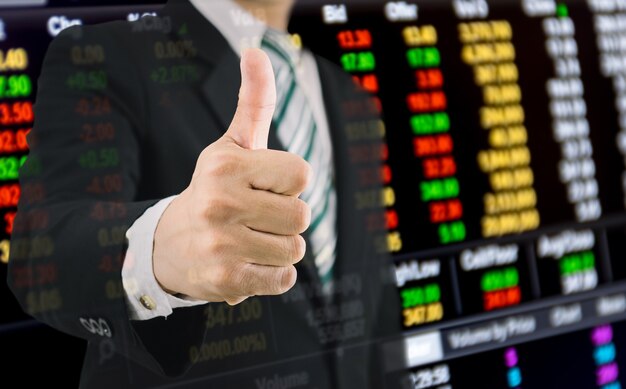 Business finance and the stock market get thumbs up from a businessman