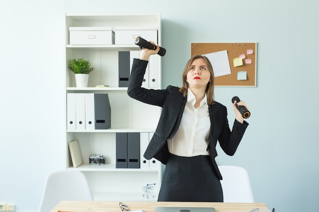 Business fitness people concept  tired business woman working and doing sport at her office