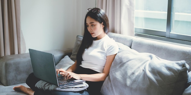 Business freelance worker woman working from home with laptop computer or digital tablet