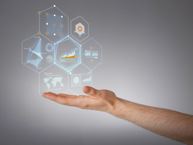 business and future technology concept - close up of male hand showing virtual screen