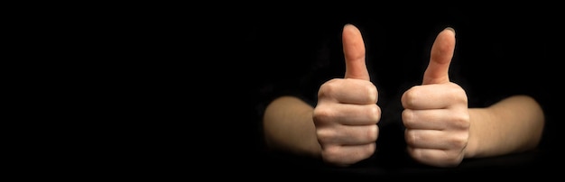 Business gesture thumb up closeup banner black background with copy space