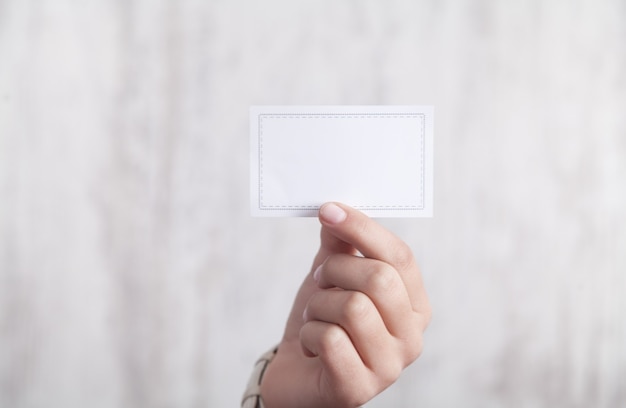 Business girl holding business card. Business concept